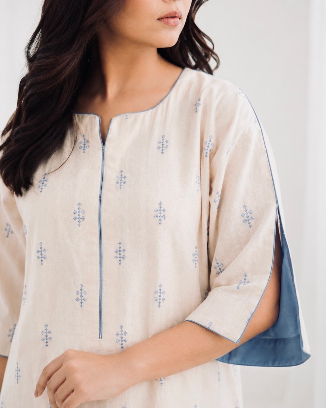 IVORY SKY ivory co-ord set front close-up, women 2-piece outfit fabric detail and fit.